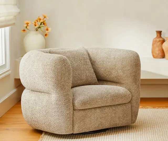 Boucle swivel chair styled in a sunlit corner