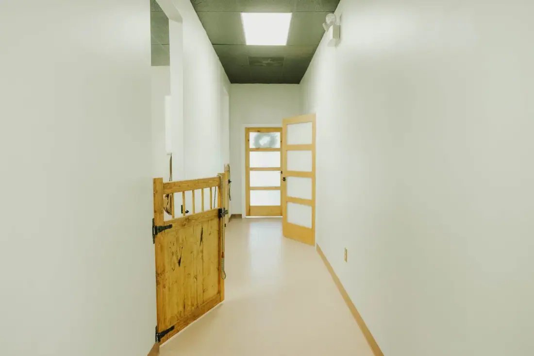 Bright commercial hallway with custom wood half gates